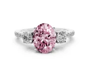 Fancy Pink Oval Cut Diamond Three-Stone Ring Set in Silver with Pavé Band and Graduated Sides