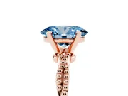 Fancy Blue Oval Cut Diamond Solitaire Ring Set in Rose gold with Twisted Band and Bead Prong Setting
