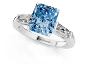 Fancy Blue Radiant Cut Diamond Solitaire Ring Set in Silver with Tapered Baguette Side Stones and Prong Setting
