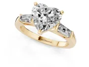 Heart Cut Diamond Solitaire Ring Set in Yellow gold with Tapered Baguette Side Stones and Prong Setting
