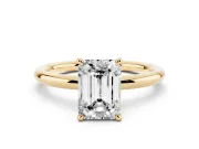 Emerald Cut Diamond Solitaire Ring Set in Yellow gold with Thin Band and Prong Setting