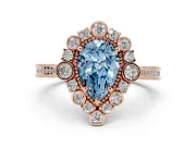 Fancy Blue Pear Cut Diamond Halo Milgrain Pavé Ring Set in Rose gold with Prong Setting