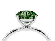 Fancy Green Round Cut Diamond Solitaire Engagement Ring Set in Platinum with Thin Band and Prong Setting
