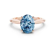 Fancy Blue Oval Cut Diamond Solitaire Ring Set in Rose gold with Prong Setting on a Plain Round Band