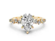 Pear Cut Diamond Solitaire Vine Band Ring Set in Yellow gold with Round Accents and Prong Setting