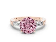 Fancy Pink Round Cut Diamond Solitaire Ring Set in Rose gold with Tapered Baguette Side Stones and Prong Setting