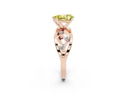 Fancy Yellow Pear Cut Diamond Solitaire Ring Set in Rose gold with Side Stones on Criss-Cross Band and Prong Setting