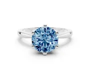 Fancy Blue Round Cut Diamond Solitaire Engagement Ring Set in Platinum with Slim Tapered Solitaire Band