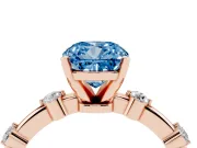Fancy Blue Cushion Cut Diamond Solitaire Ring Set in Rose gold with Bezel Set Side Stones and Prong Setting