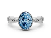 Fancy Blue Oval Cut Diamond Vintage-Inspired Milgrain Ring Set in White gold with Marquise Stations of Round Accents