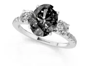 Fancy Black Oval Cut Diamond Three-Stone Ring Set in Platinum with Pavé Band and Graduated Sides
