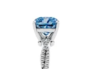 Fancy Blue Cushion Cut Diamond Solitaire Ring Set in White gold with Twisted Band and Bead Prong Setting