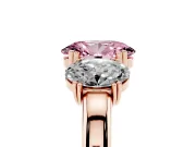 Fancy Pink Oval Cut Diamond Three-Stone Ring Set in Rose gold with Polished Band and Prong Setting