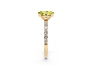 Fancy Yellow Oval Cut Diamond Solitaire Ring Set in Yellow gold with Round Pavé Band and Prong Setting