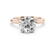 Round Cut Diamond Solitaire Engagement Ring Set in Rose gold with Prong Setting and Polished Band
