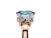 Fancy Blue Oval Cut Diamond Three-Stone Ring Set in Rose gold with Polished Band and Prong Setting