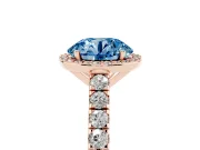 Fancy Blue Round Cut Diamond Halo Engagement Ring Set in Rose gold with Pavé Band and Prong Setting