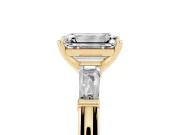 Emerald Cut Diamond Solitaire Ring Set in Yellow gold with Tapered Baguette Side Stones and Prong Setting