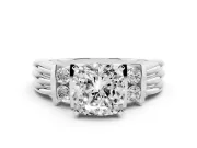 Three-Stone Cushion Cut Diamond Channel Set Ring Set in Platinum with Bar Prongs