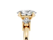 Three-Stone Oval Cut Diamond Ring Set in Yellow gold with Prong Setting and Plain Band