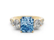 Fancy Blue Three-Stone Radiant Cut Diamond Pavé Band Ring Set in Yellow gold with Prong-Set Trio