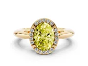 Fancy Yellow Oval Cut Diamond Halo Engagement Ring Set in Yellow gold with Plain Split Shank and Prong Setting