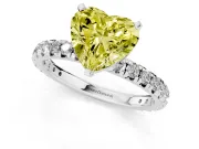 Fancy Yellow Heart Cut Diamond Pavé Solitaire Ring Set in White gold with Round Band and Prong Setting