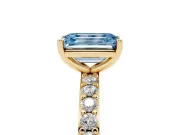 Fancy Blue Emerald Cut Diamond Solitaire Set in Yellow gold with Round Pavé Band and Prong Setting