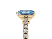 Fancy Blue Emerald Cut Diamond Solitaire Engagement Ring Set in Yellow gold with Delicate Pavé Band and Prong Setting