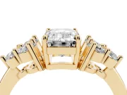 Emerald Cut Diamond Solitaire Ring Set in Yellow gold with Cluster Accents on Each Side