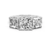Princess Cut Diamond Three-Stone Ring Set in White gold with Channel-Set Band and Prong Settings