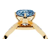Fancy Blue Heart Cut Diamond Twist Band Solitaire Ring Set in Yellow gold with Leaf Prong Setting and Accent Stones