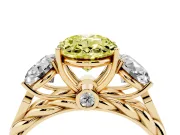Fancy Yellow Oval Cut Diamond Three-Stone Ring Set in Yellow gold with Braided Band