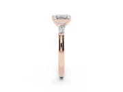 Emerald Cut Diamond Solitaire Ring Set in Rose gold with Tapered Baguette Side Stones and Prong Setting