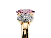 Fancy Pink Oval Cut Diamond Three-Stone Ring Set in Yellow gold with Bold Center and Classic Band