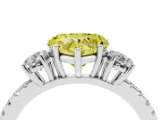 Fancy Yellow Heart Cut Diamond Three-Stone Ring Set in White gold with Pavé Band and Graduated Sides