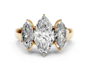 Three-Stone Marquise Cut Diamond Ring Set in Yellow gold with Matching Prong Settings and Plain Band