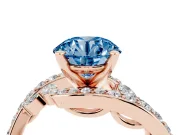 Fancy Blue Round Cut Diamond Solitaire Ring Set in Rose gold with Pavé Twist Band and Secure Prong Setting