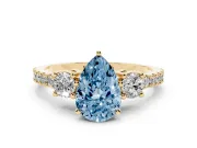 Fancy Blue Three-Stone Pear Cut Diamond Pavé Band Ring Set in Yellow gold with Prong Setting