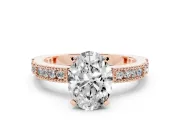 Oval Cut Diamond Solitaire Ring Set in Rose gold with Slim Pavé Band and Prong Setting