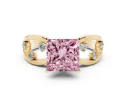 Fancy Pink Princess Cut Diamond Solitaire Ring Set in Yellow gold with Side Stones on Criss-Cross Band and Prong Setting