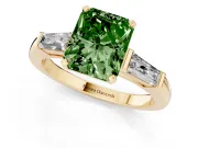 Fancy Green Radiant Cut Diamond Solitaire Ring Set in Yellow gold with Tapered Baguette Side Stones and Prong Setting