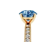 Fancy Blue Round Cut Diamond Solitaire Ring Set in Yellow gold with Slim Pavé Band and Prong Setting