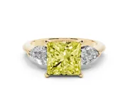 Fancy Yellow Three-Stone Princess Cut Diamond Ring Set in Yellow gold with Pear Side Stones and Prong Setting