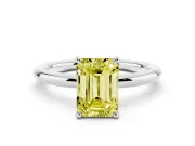 Fancy Yellow Emerald Cut Diamond Solitaire Ring Set in White gold with Thin Band and Prong Setting