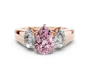Fancy Pink Three-Stone Pear Cut Diamond Ring Set in Rose gold with Matching Prong Settings and Plain Band