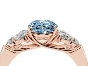 Fancy Blue Oval Cut Diamond Cluster Ring Set in Rose gold with Round Accent Stones and Prong Setting on a Plain Band