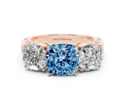 Fancy Blue Cushion Cut Diamond Three-Stone Ring Set in Rose gold with Textured Band