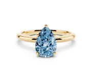 Fancy Blue Pear Cut Diamond Solitaire Engagement Ring Set in Yellow gold with Prong Setting and Polished Band