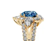 Fancy Blue Heart Cut Diamond Halo Split Shank Engagement Ring Set in Yellow gold with Prong-Held Center Stone